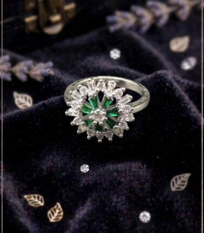 Silver-tone green floral statement ring with sparkling clear accents by https://vastorastore.com/