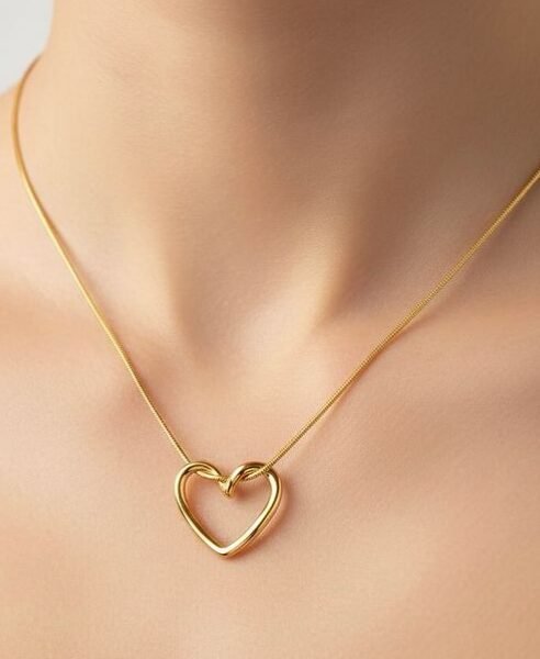 Luxury Gold Open Heart Pendant Necklace for Women with a polished open-heart charm on a sleek gold-tone snake chain by https://vastorastore.com/