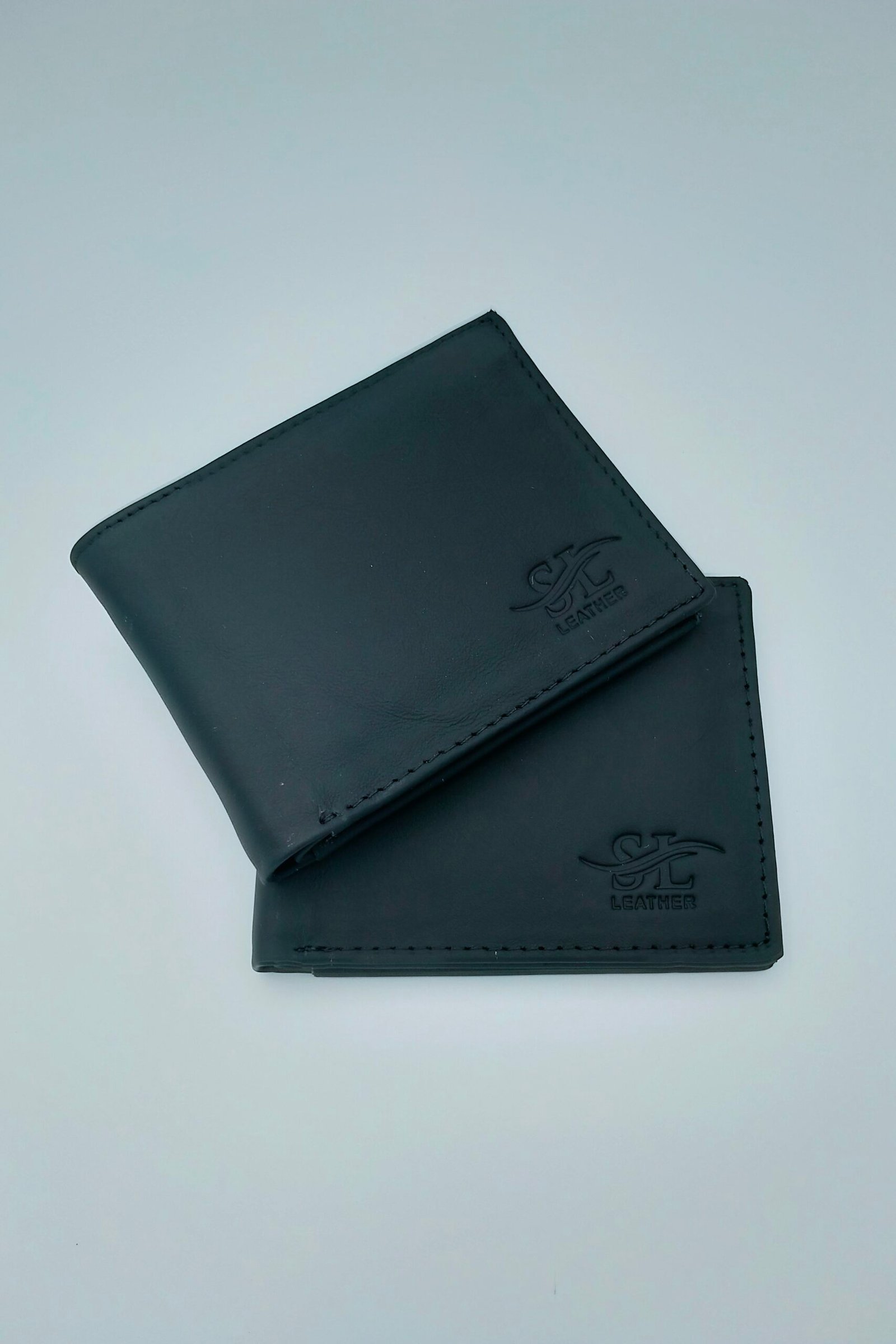 Premium Black Leather Wallet for Men Premium black leather wallet for men with stitched edges and embossed logo by https://vastorastore.com/